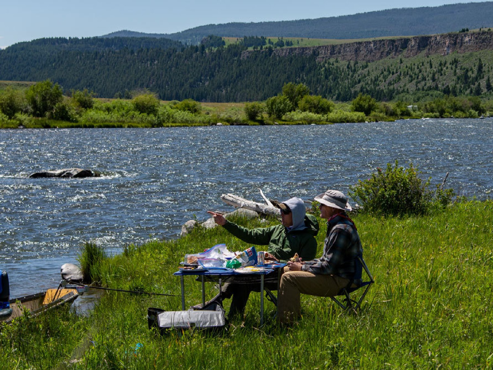 Guests eating lunch with Montana fly fishing guides