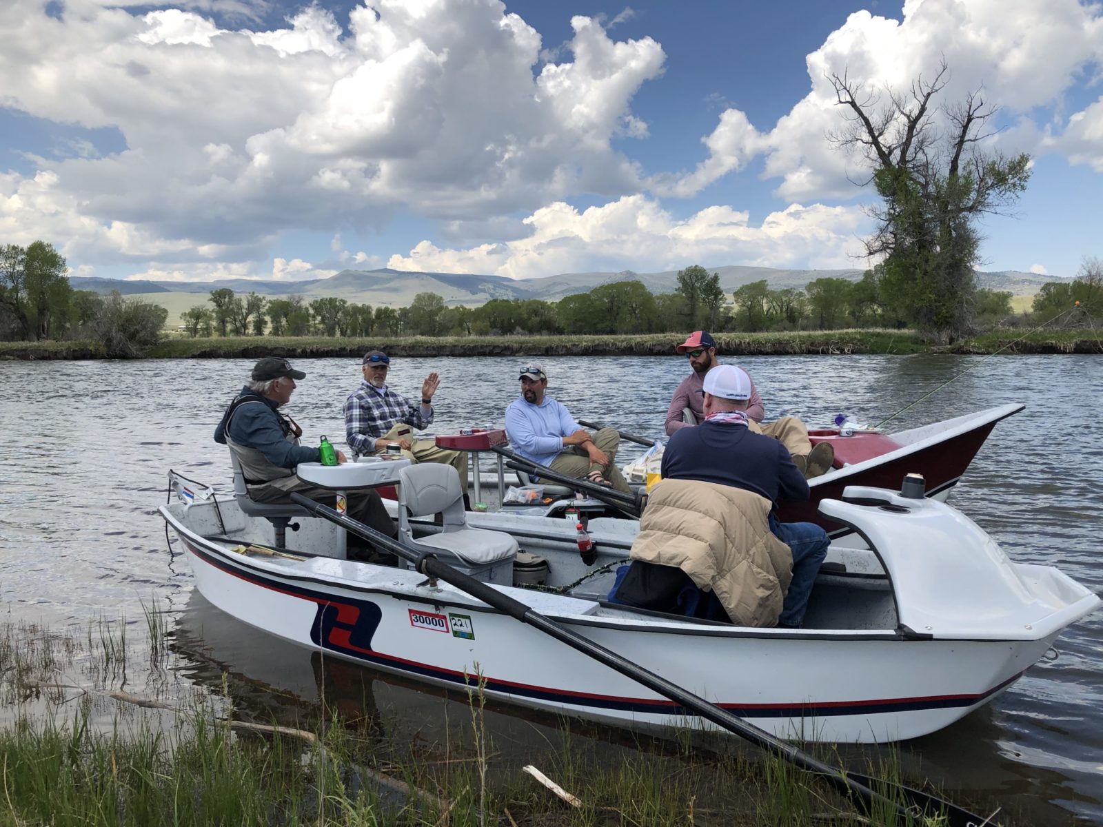 Montana fly fishing guides with guests on boat
