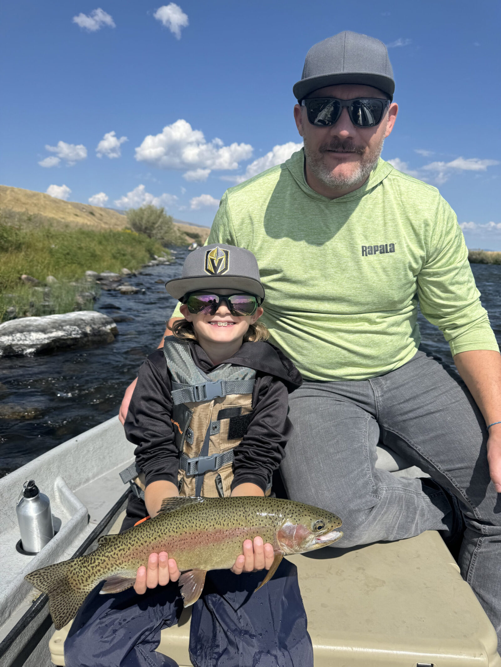 Father and son with a nice rainbow on the Madison River